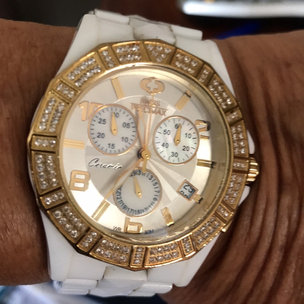 beautiful swarovski crystal and ceramic battery operated woman’s watch.